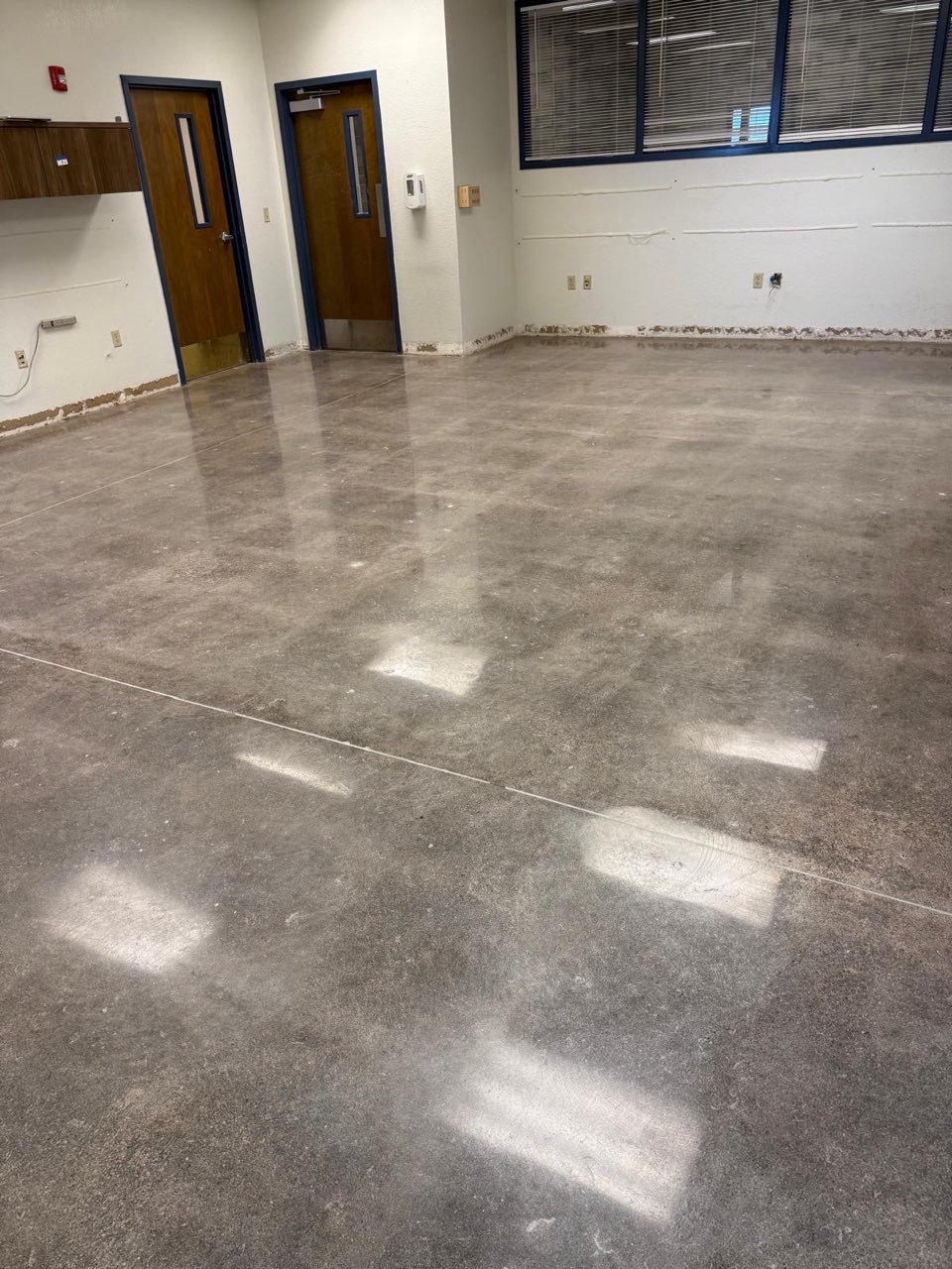 Polished grey concrete floor in a commercial building