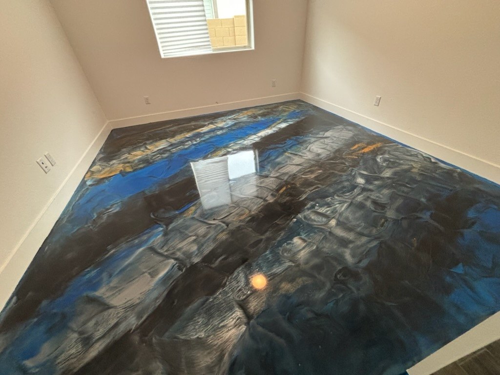 Blue metallic epoxy floor with a marbled pattern