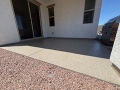 Covered patio slab next to a gravel yard