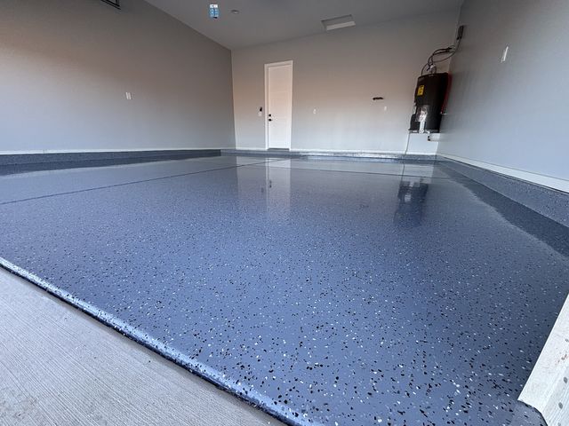 Close view of a blue-grey flake epoxy garage floor